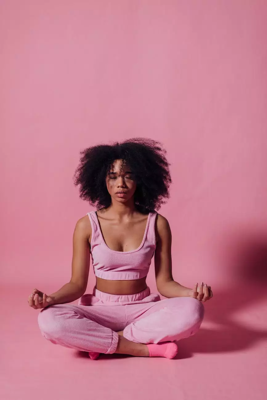 A rounded natural hair silhouette against a pink background